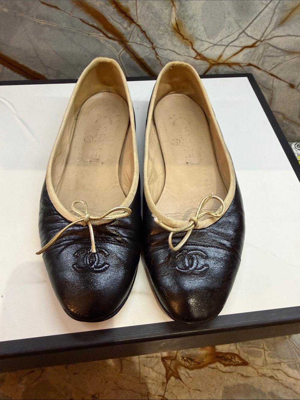 CHANEL Black Leather Ballet Flats with Cream Trim